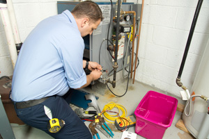 Worker repairing furnace Worker repairing furnace